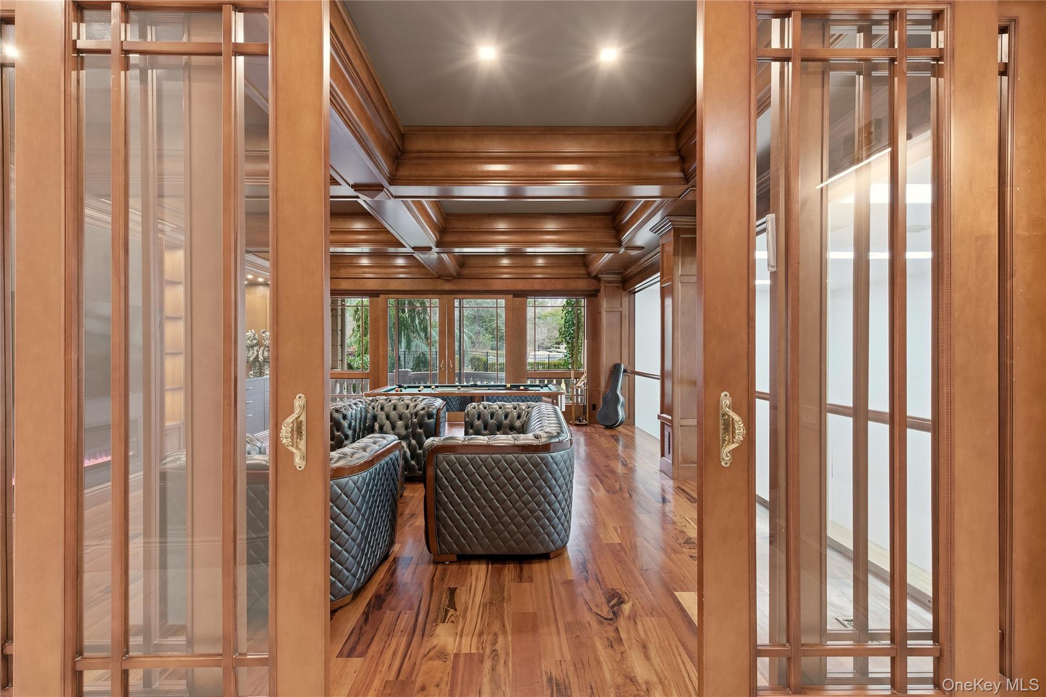 55 Coves Run Syosset, NY 11791 - Photo 19 of 50 a view of a room with wooden floor and furniture