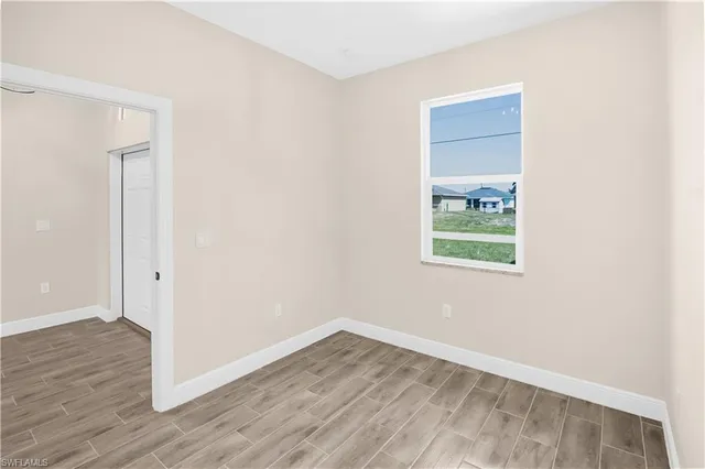 a view of a kitchen with a sink and a window