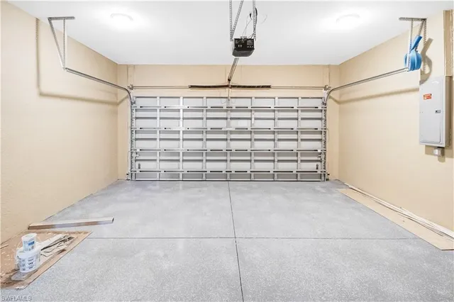 a view of empty room with white wall and dryer