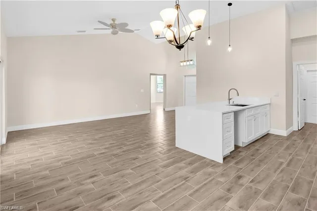 a view of a kitchen counter space and wooden floor