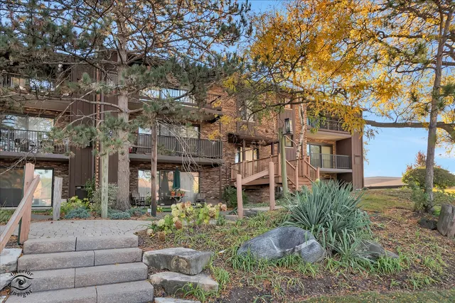 a house view with a seating space and garden