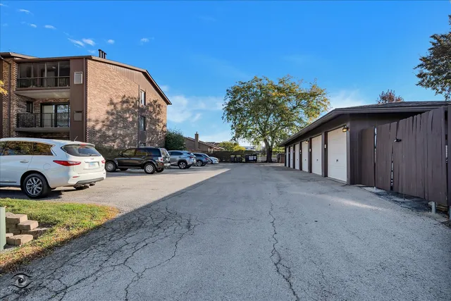 a view of a street with a car parked in front of it