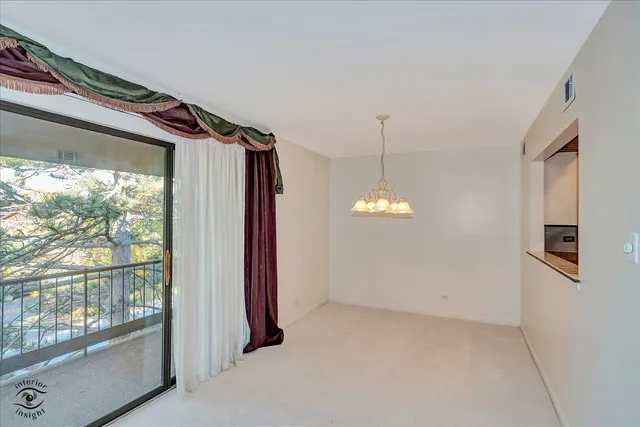 a view of a room with large windows