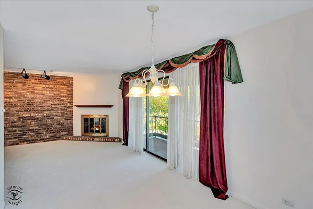 a view of a bedroom with a balcony and window
