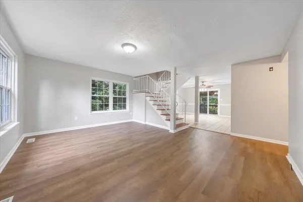 a view of an empty room with a window
