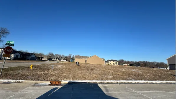 a view of a road with a building in the background
