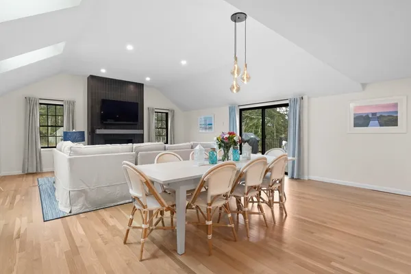 a view of a dining room with furniture window and wooden floor