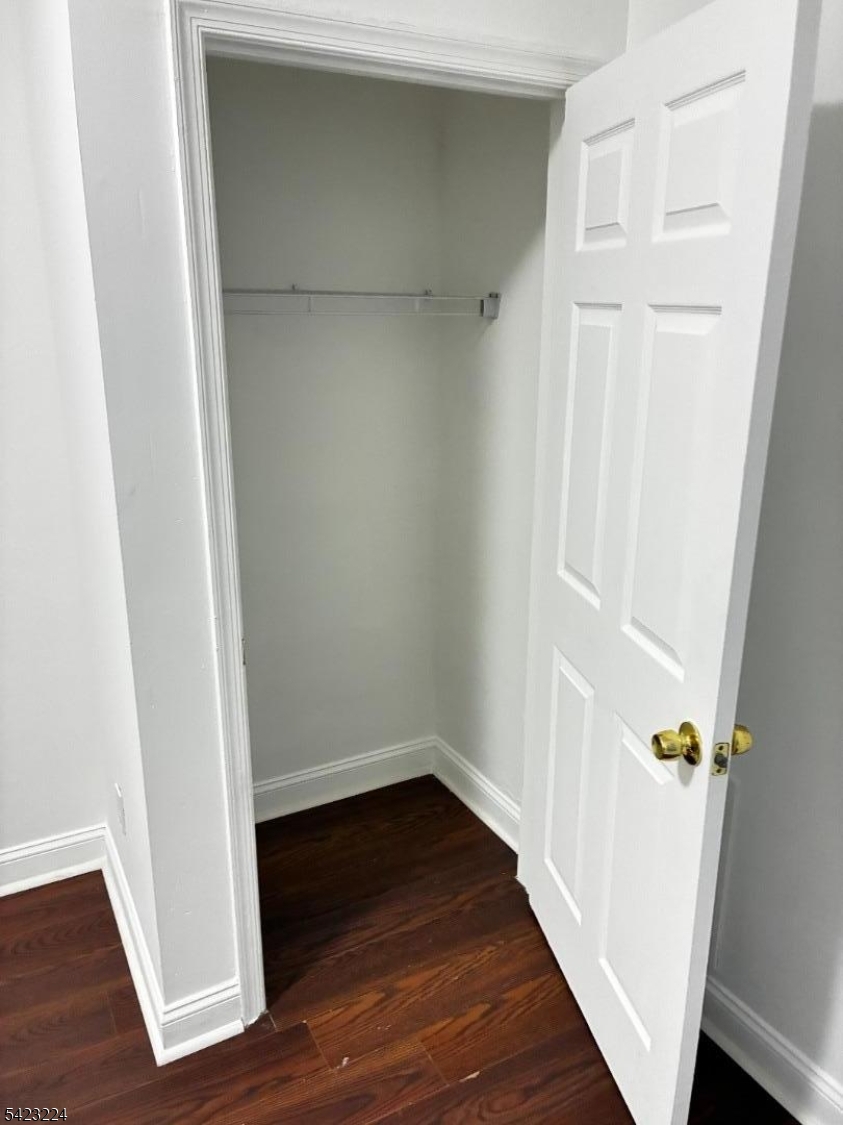 73 Wolcott Terrace Newark, NJ 07112 - Photo 14 of 20 a view of a hallway with wooden floor