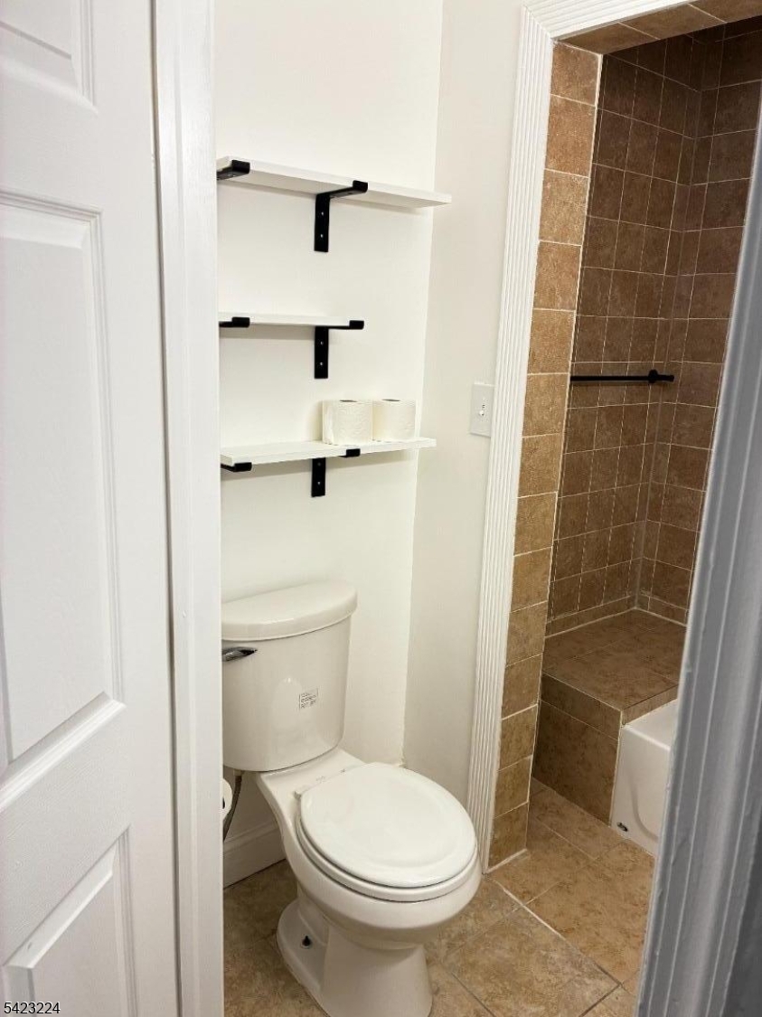73 Wolcott Terrace Newark, NJ 07112 - Photo 9 of 20 a bathroom with a toilet and a shower