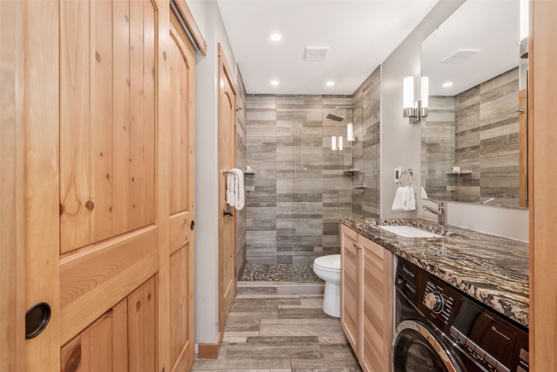 2025 Walton Creek Road, Unit 315 Steamboat Springs, CO 80487 - Photo 28 of 37 Gorgeous shower, granite counters and updated lighting and fixtures.