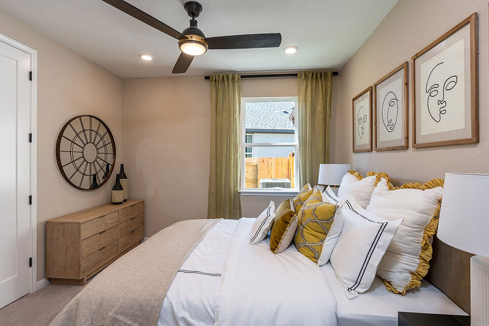 1212 Scenic Grn Loop Georgetown, TX 78628 - Photo 20 of 36 a bedroom with a bed a mirror and a window