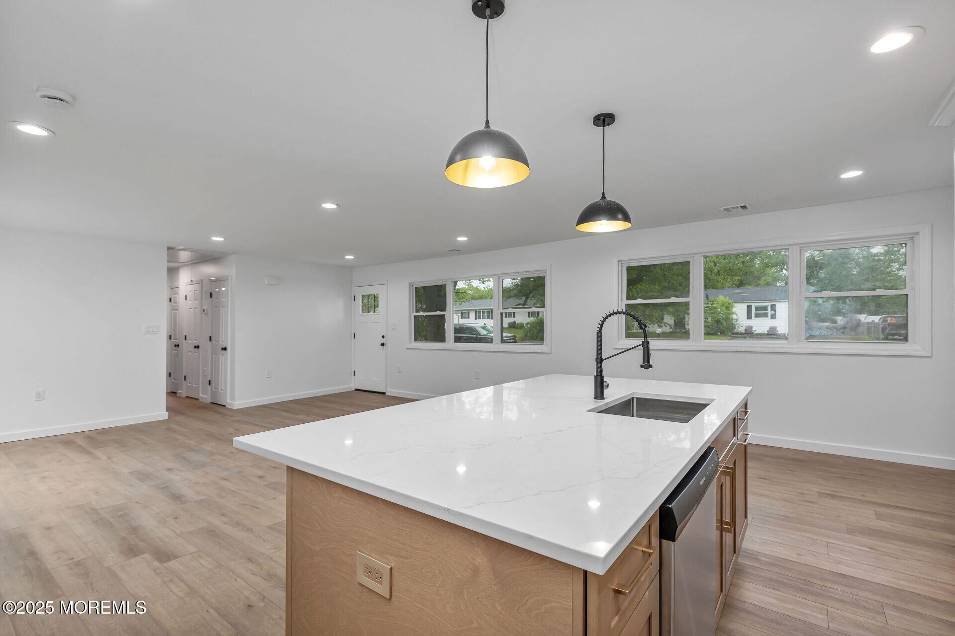138 Stephan Road Brick, NJ 08724 - Photo 13 of 38 a kitchen with stainless steel appliances granite countertop a sink a large oven and a chandelier