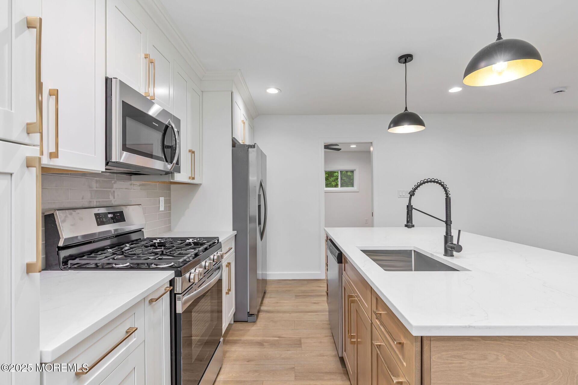 138 Stephan Road Brick, NJ 08724 - Photo 14 of 38 a kitchen with stainless steel appliances granite countertop a sink stove a refrigerator and a microwave