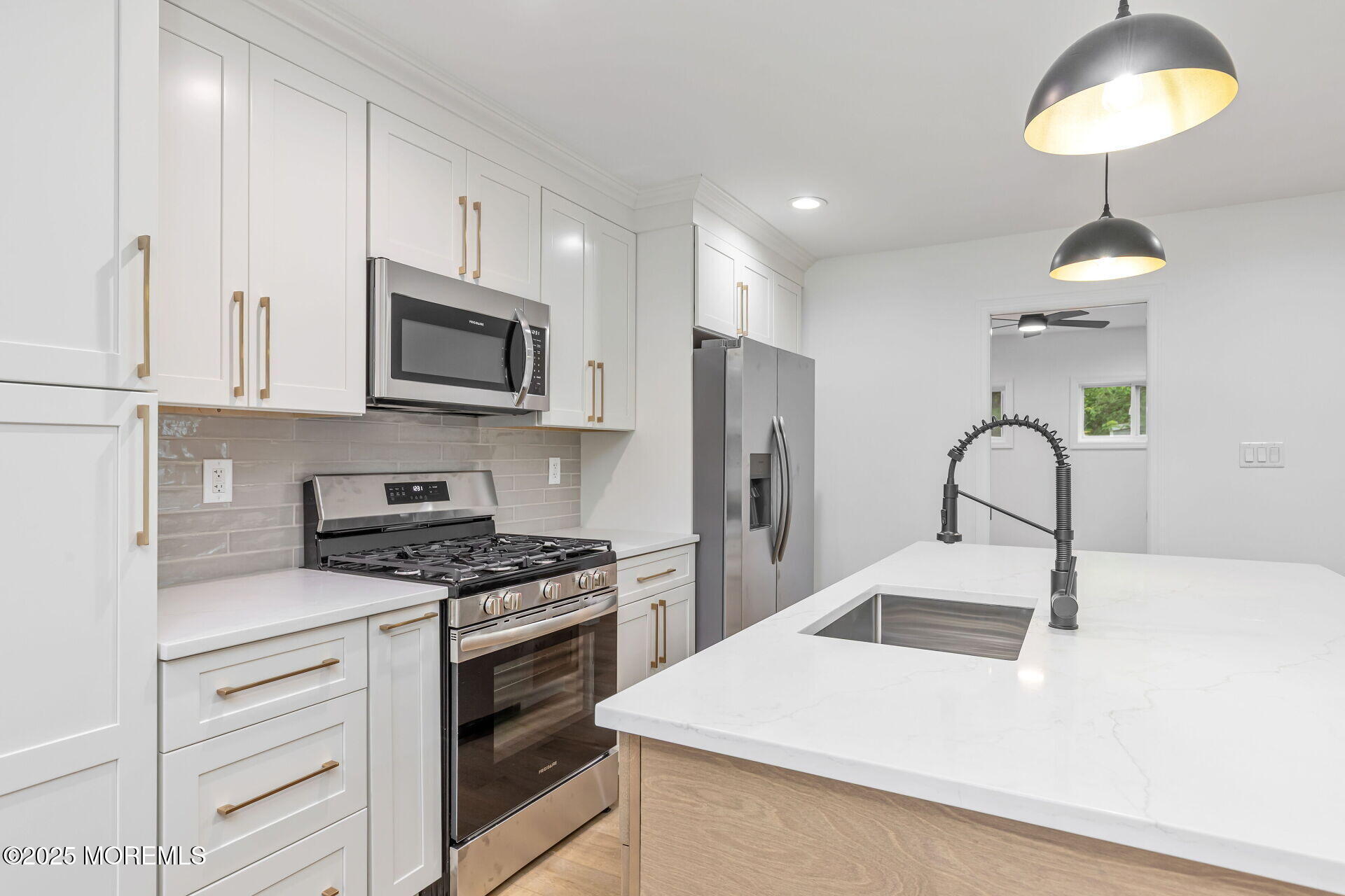 138 Stephan Road Brick, NJ 08724 - Photo 15 of 38 a kitchen with a sink a stove and refrigerator