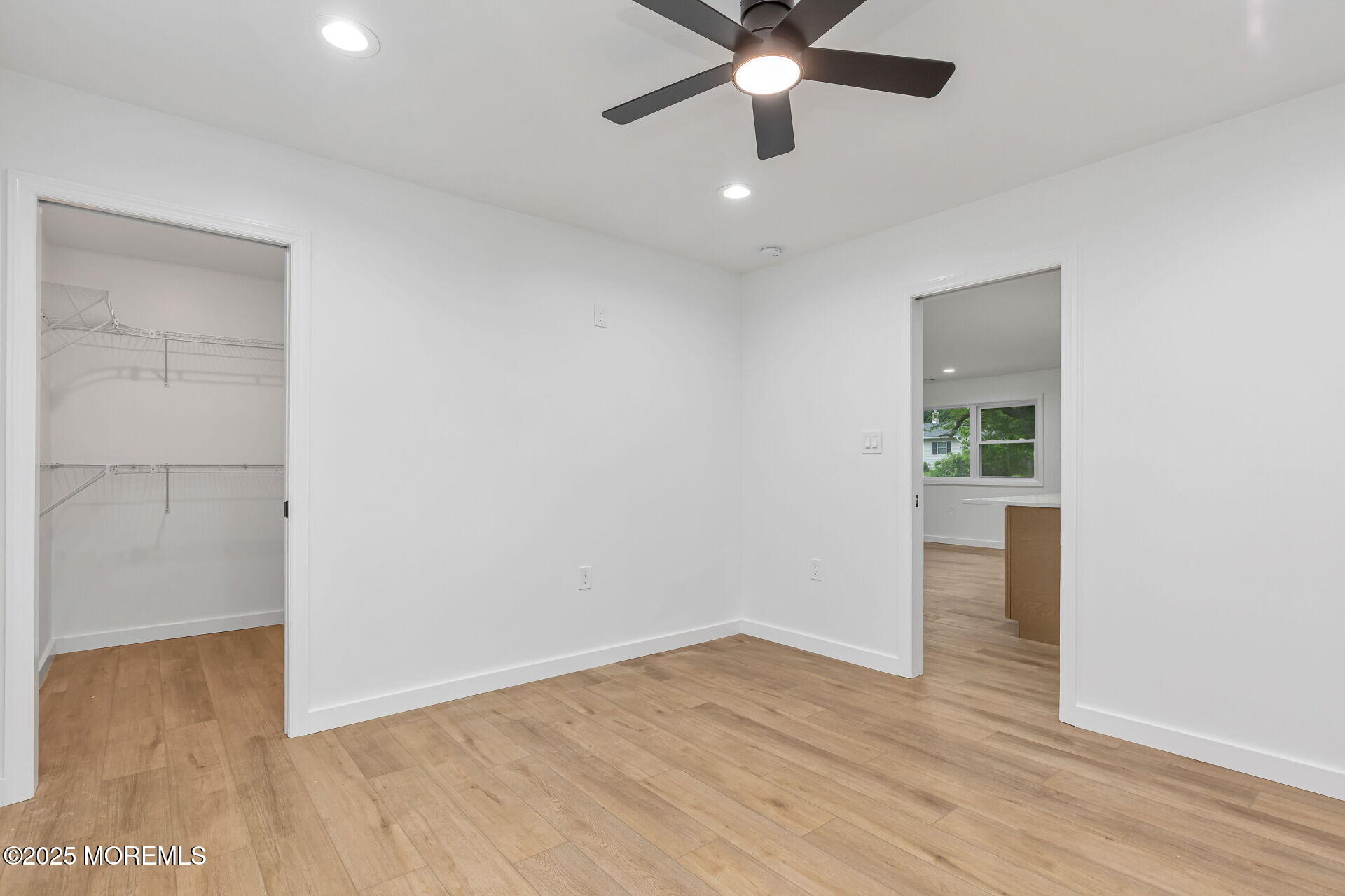 138 Stephan Road Brick, NJ 08724 - Photo 18 of 38 an empty room with wooden floor and windows