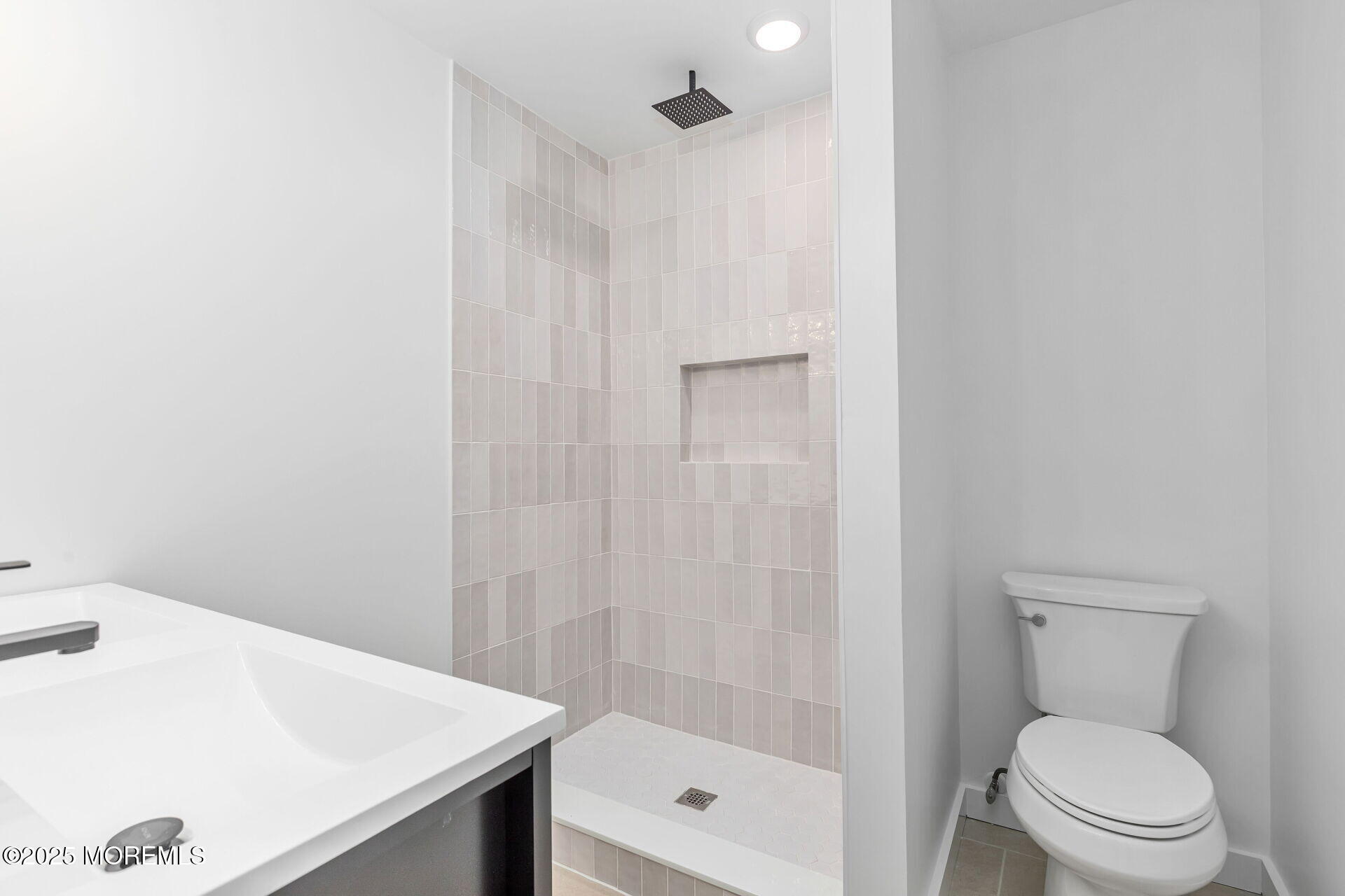 138 Stephan Road Brick, NJ 08724 - Photo 20 of 38 a bathroom with a shower a toilet and a sink