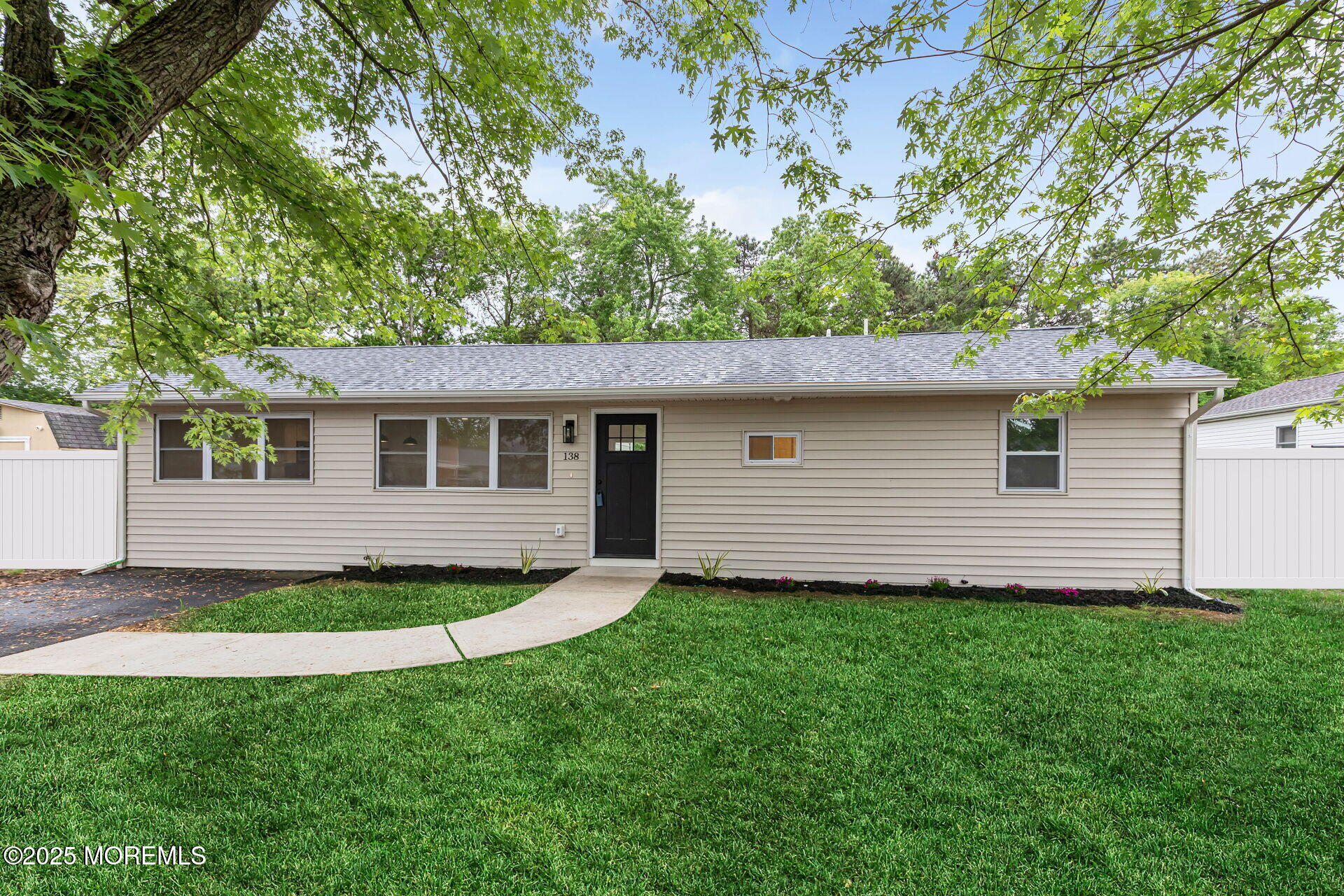 138 Stephan Road Brick, NJ 08724 - Photo 2 of 38 a view of a backyard with plants and large tree