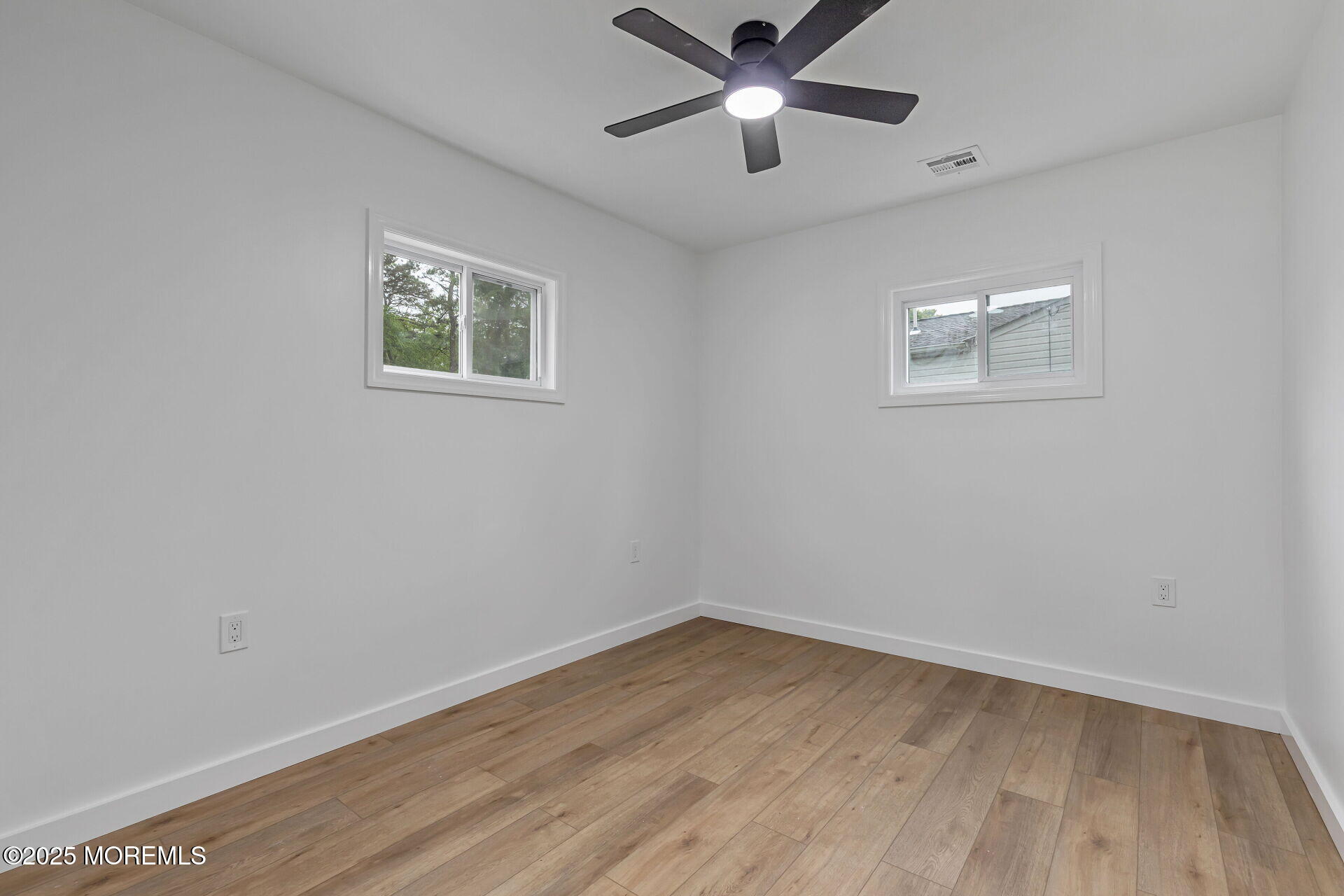 138 Stephan Road Brick, NJ 08724 - Photo 26 of 38 an empty room with a window and a fan