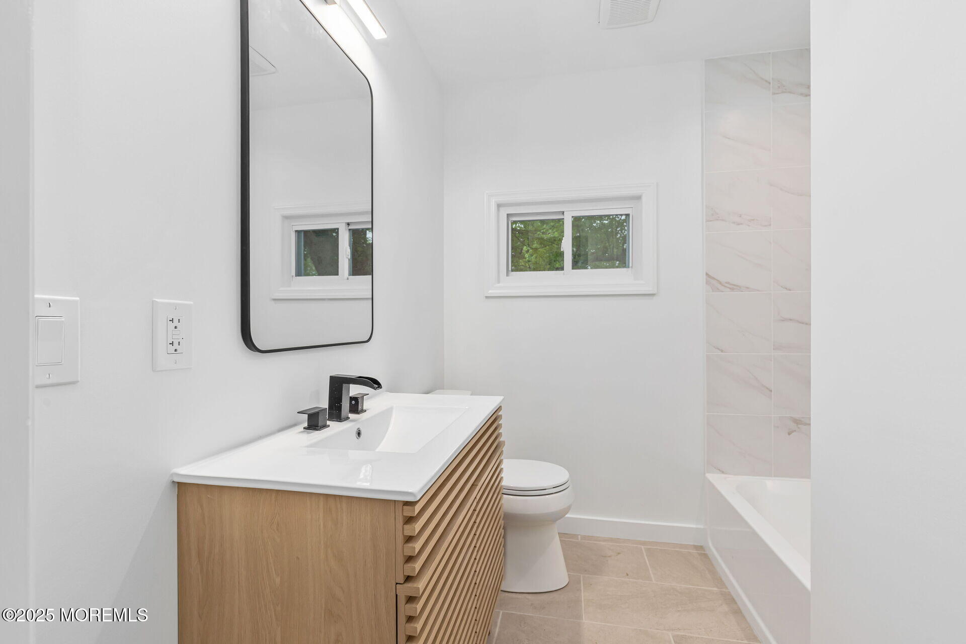 138 Stephan Road Brick, NJ 08724 - Photo 30 of 38 a bathroom with a toilet sink and mirror