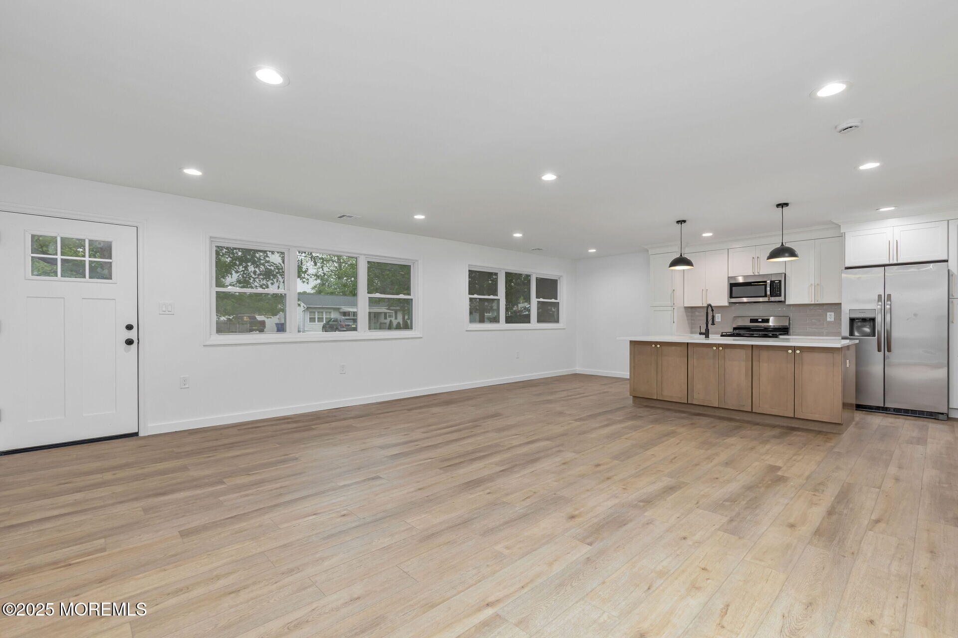 138 Stephan Road Brick, NJ 08724 - Photo 7 of 38 a view of kitchen with wooden floor and electronic appliances