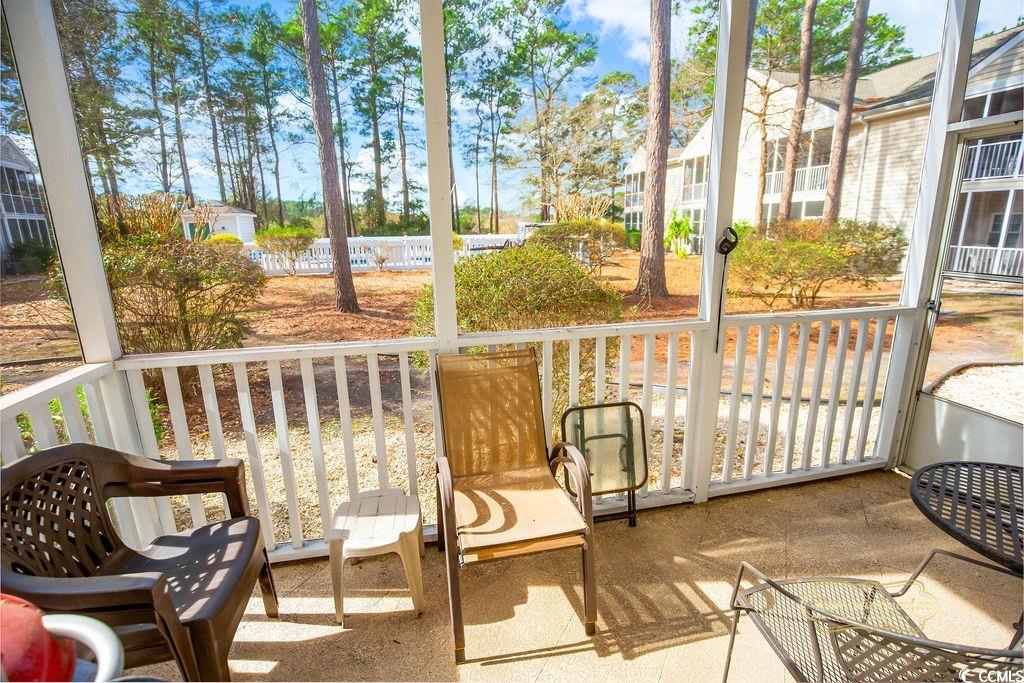2203 Sweetwater Boulevard, Unit 2203 Murrells Inlet, SC 29576 - Photo 16 of 23 Sunroom featuring a healthy amount of sunlight
