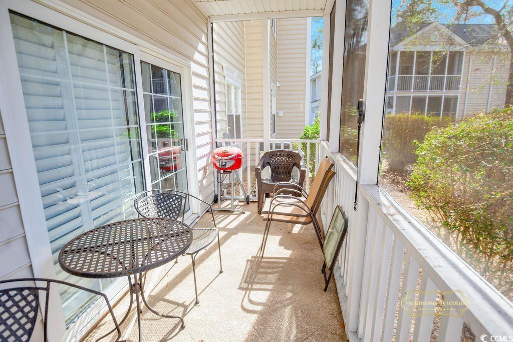 2203 Sweetwater Boulevard, Unit 2203 Murrells Inlet, SC 29576 - Photo 17 of 23 View of sunroom / solarium