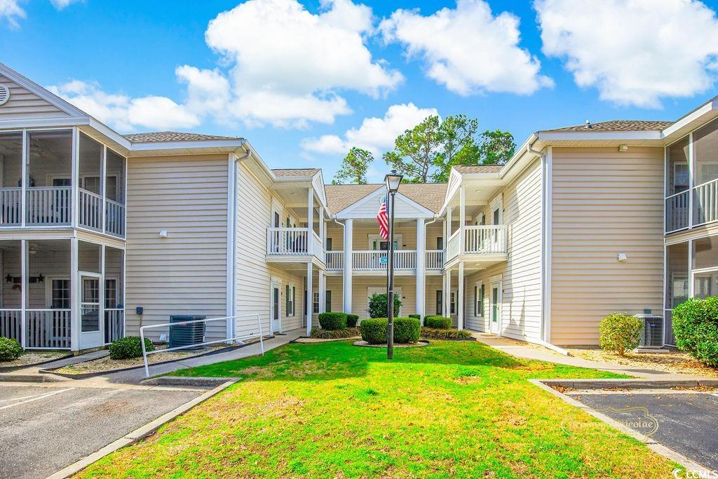 2203 Sweetwater Boulevard, Unit 2203 Murrells Inlet, SC 29576 - Photo 20 of 23 View of building exterior featuring central AC unit