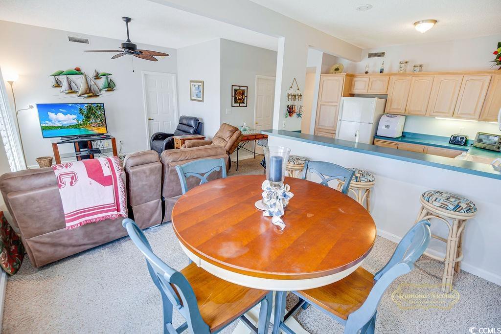 2203 Sweetwater Boulevard, Unit 2203 Murrells Inlet, SC 29576 - Photo 7 of 23 Dining room with ceiling fan and visible vents
