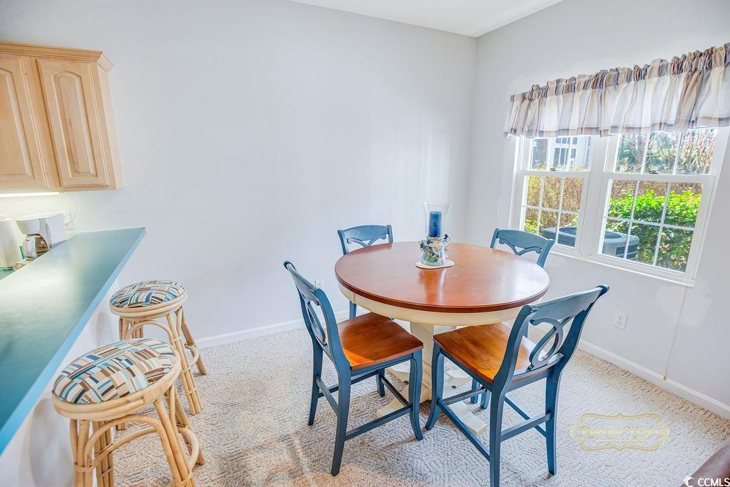 2203 Sweetwater Boulevard, Unit 2203 Murrells Inlet, SC 29576 - Photo 8 of 23 Dining room with light carpet and baseboards