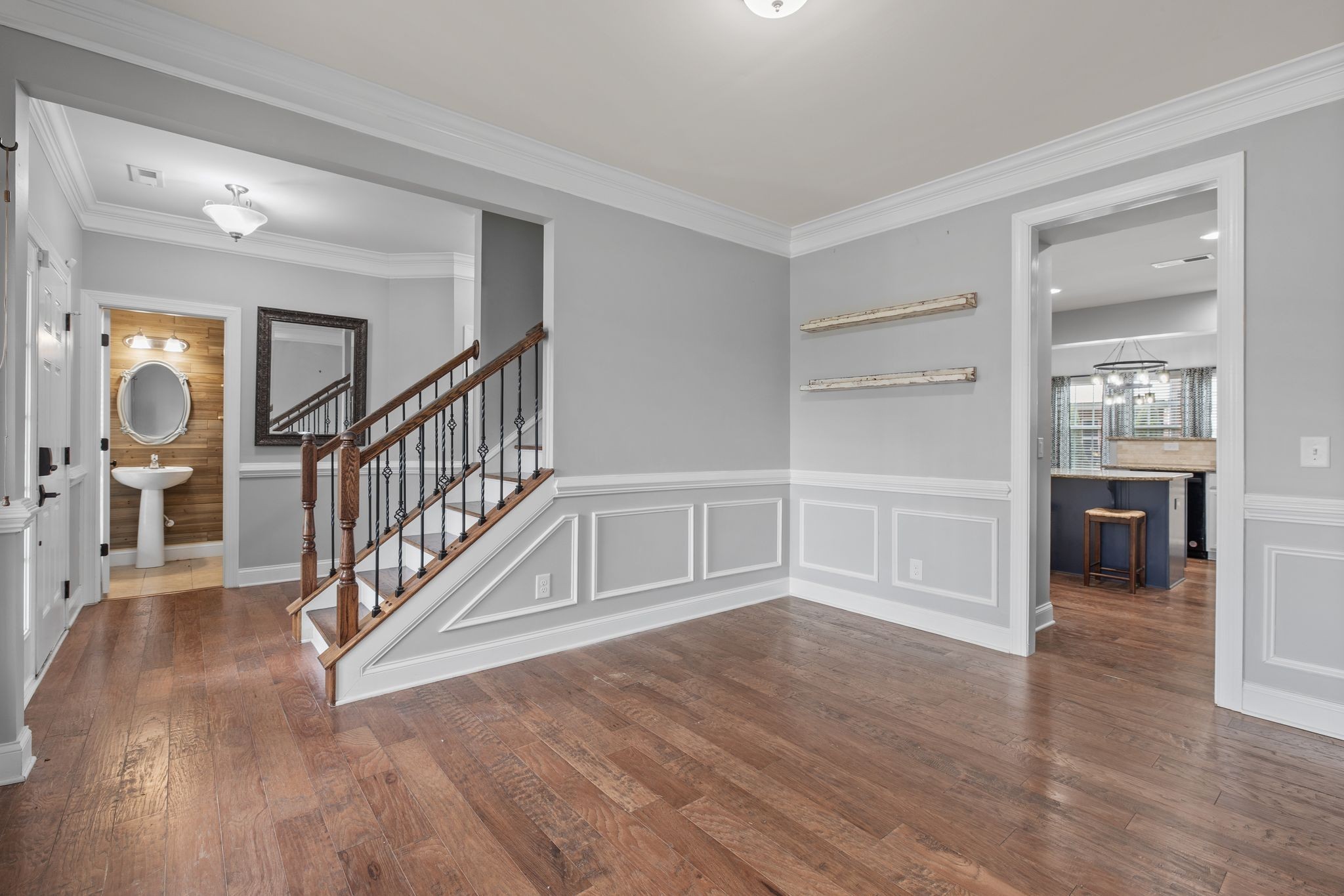1931 Portview Drive Spring Hill, TN 37174 - Photo 20 of 51 a view of a hallway with wooden floor and a kitchen