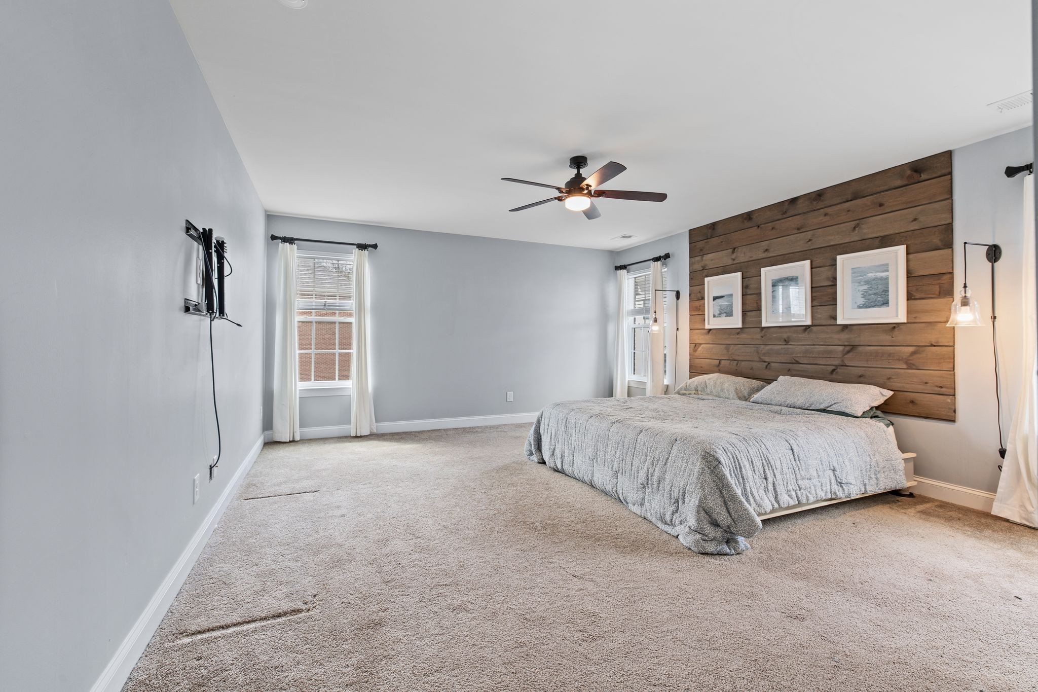 1931 Portview Drive Spring Hill, TN 37174 - Photo 32 of 51 a spacious bedroom with a large bed a chandelier and windows