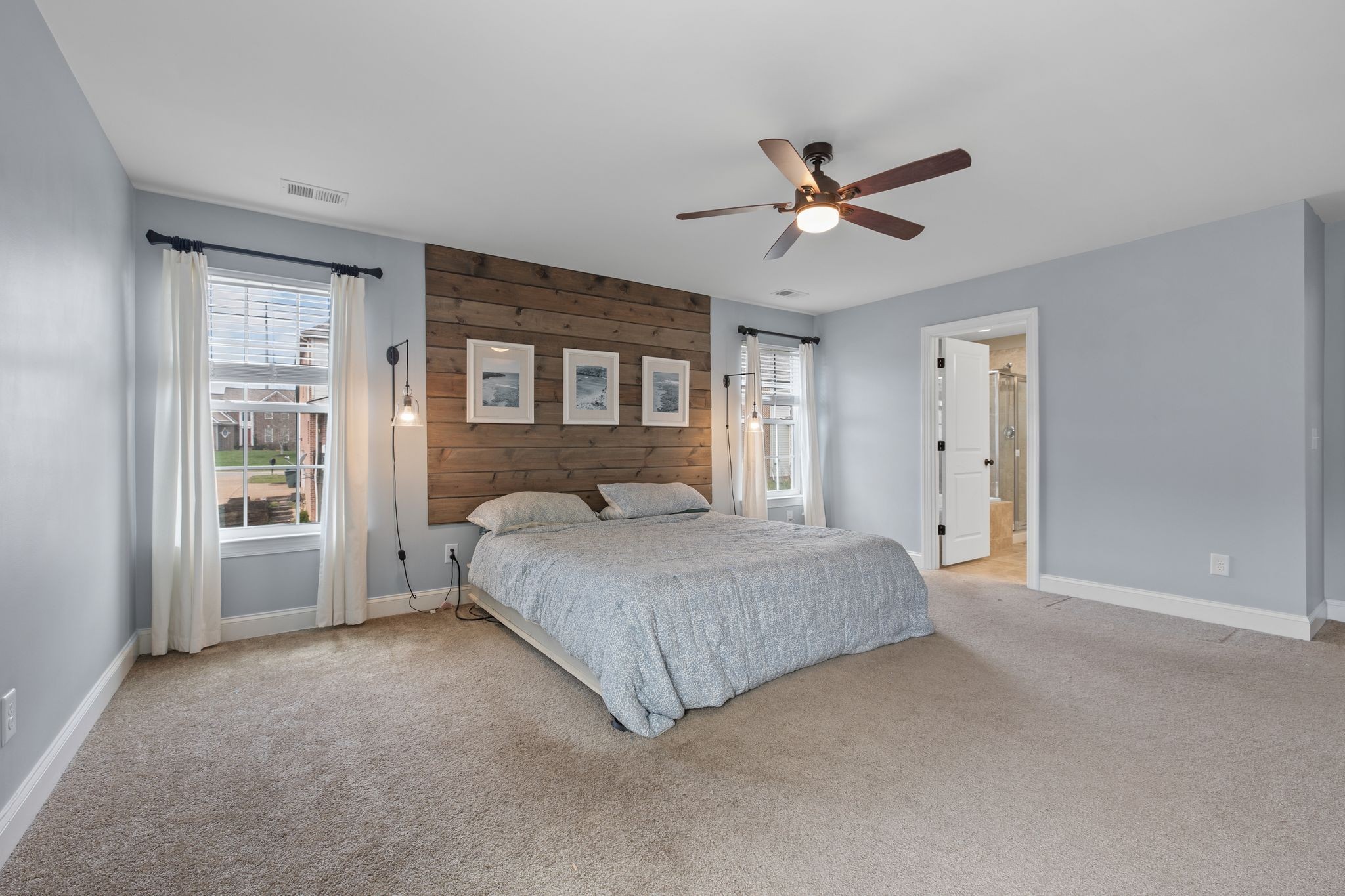 1931 Portview Drive Spring Hill, TN 37174 - Photo 33 of 51 a bedroom with a large bed closet and windows