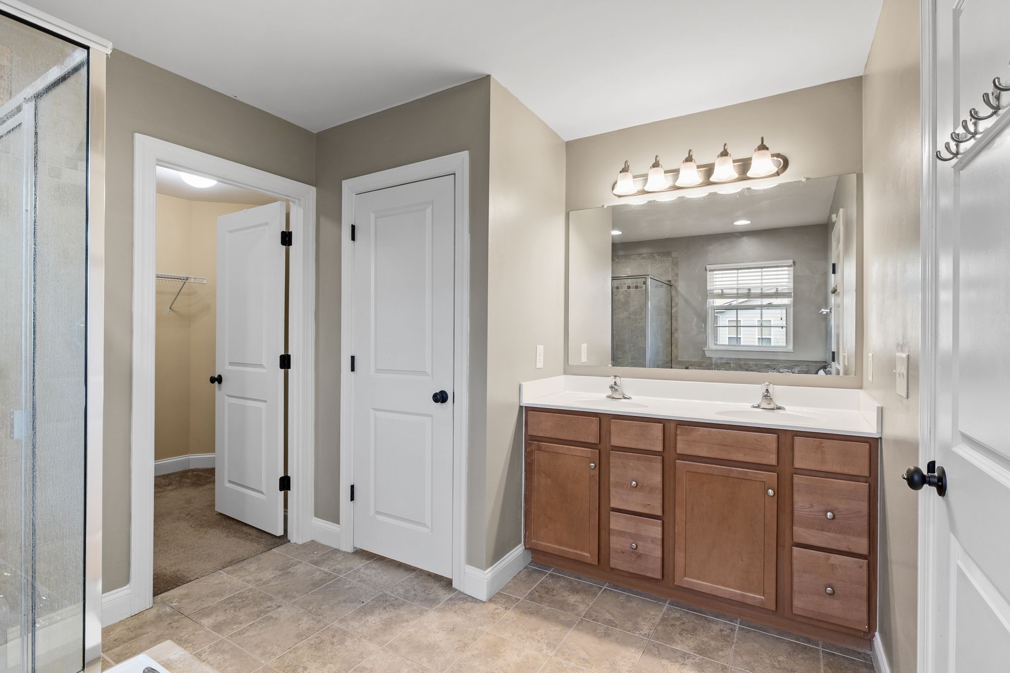 1931 Portview Drive Spring Hill, TN 37174 - Photo 34 of 51 a bathroom with a double vanity sink and a mirror