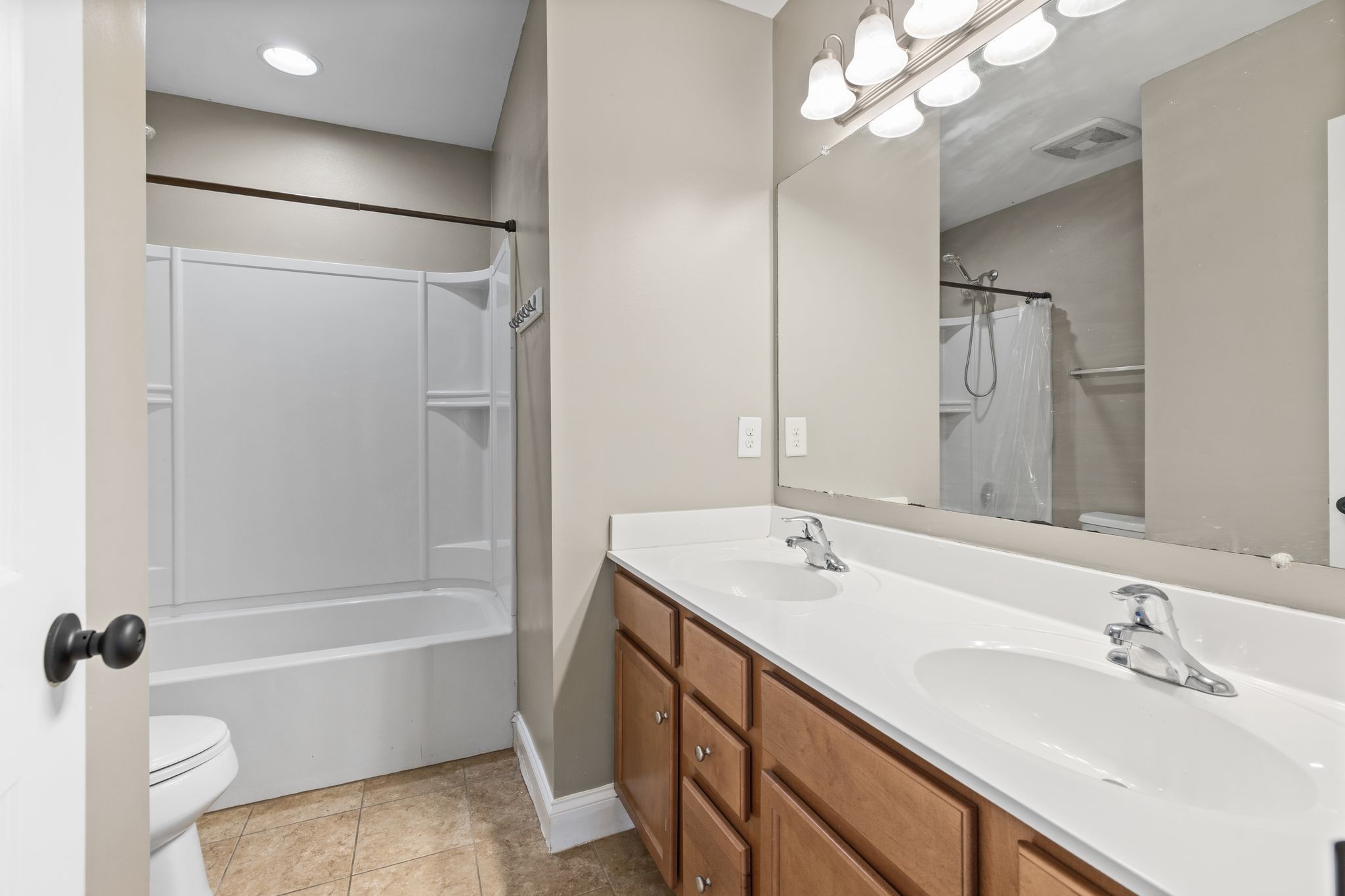 1931 Portview Drive Spring Hill, TN 37174 - Photo 38 of 51 a bathroom with a sink a toilet a mirror a bathtub and shower