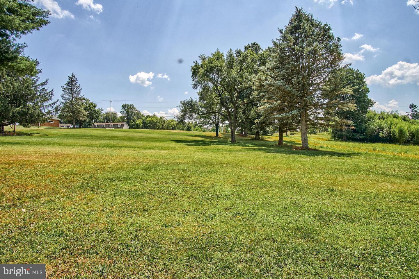 51 Old York Road Dillsburg, PA 17019 - Photo 2 of 7 a view of an ocean with a big yard and large trees