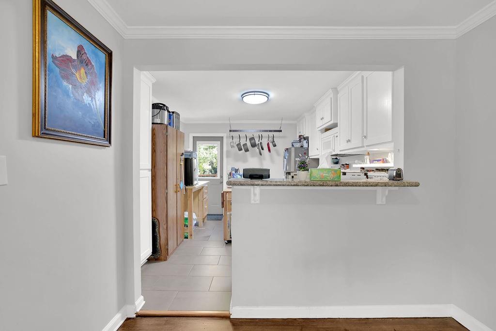 7618 Vaughn Road Woodstock, GA 30188 - Photo 16 of 44 a view of kitchen with furniture and refrigerator