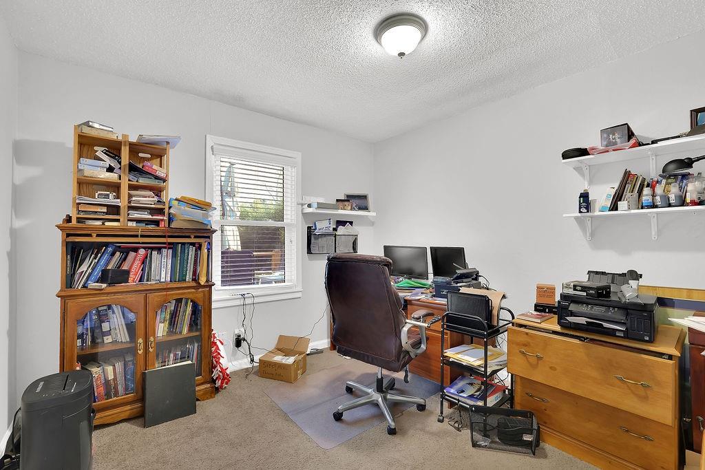 7618 Vaughn Road Woodstock, GA 30188 - Photo 20 of 44 a view of a workspace with furniture and a window