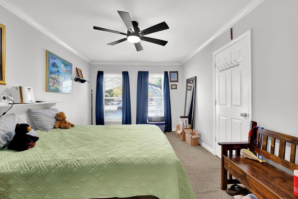 7618 Vaughn Road Woodstock, GA 30188 - Photo 26 of 44 a bedroom with a bed and a large mirror on the dresser