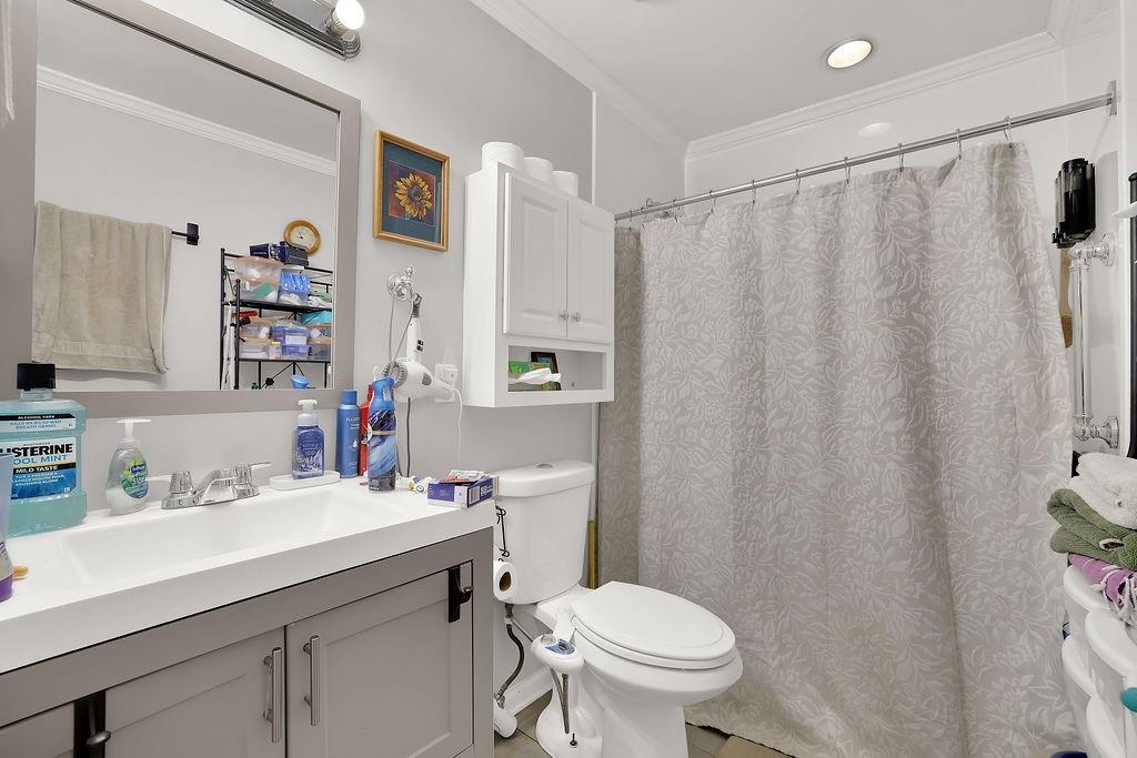 7618 Vaughn Road Woodstock, GA 30188 - Photo 29 of 44 a bathroom with a sink toilet and vanity