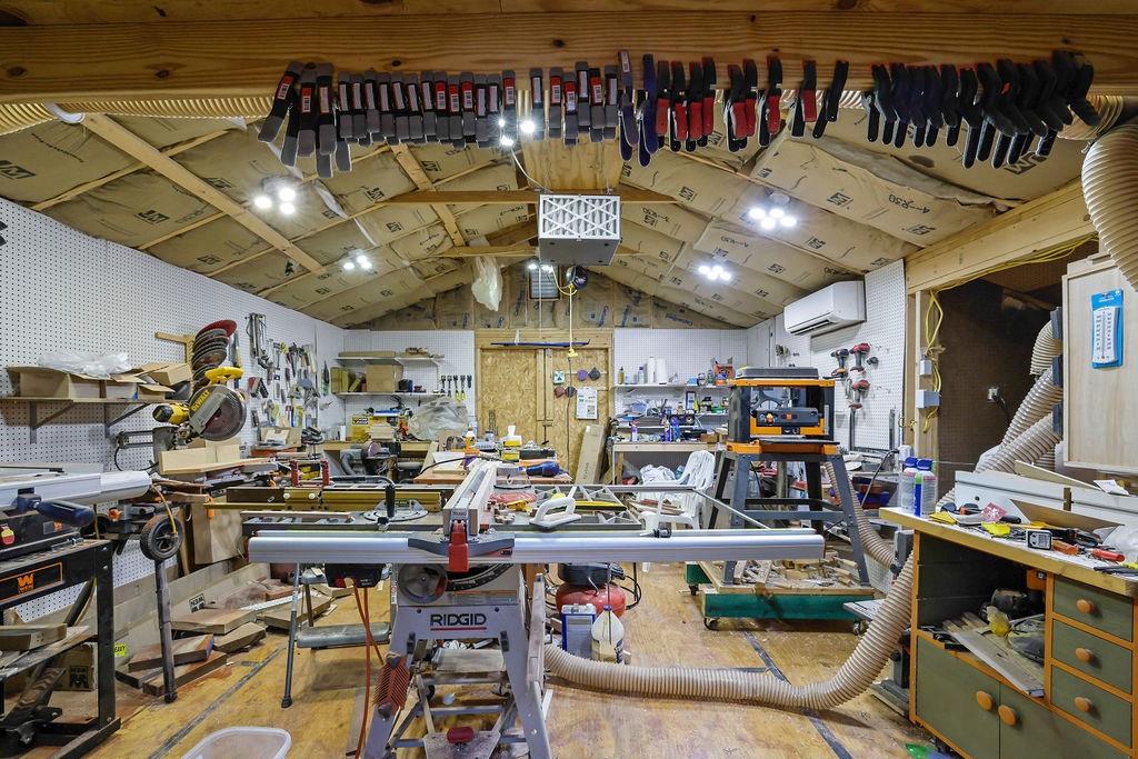 7618 Vaughn Road Woodstock, GA 30188 - Photo 30 of 44 a living room with lots of furniture and a chandelier