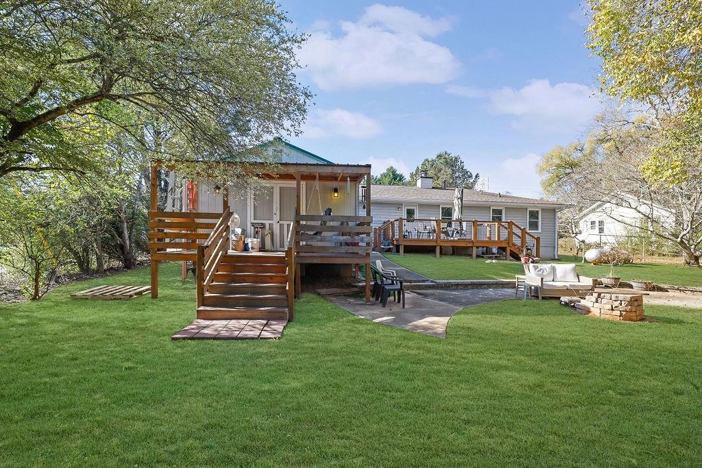 7618 Vaughn Road Woodstock, GA 30188 - Photo 34 of 44 a front view of a house with garden and a slide