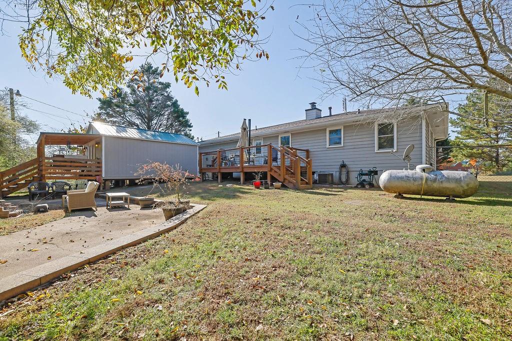 7618 Vaughn Road Woodstock, GA 30188 - Photo 37 of 44 a view of a house with backyard