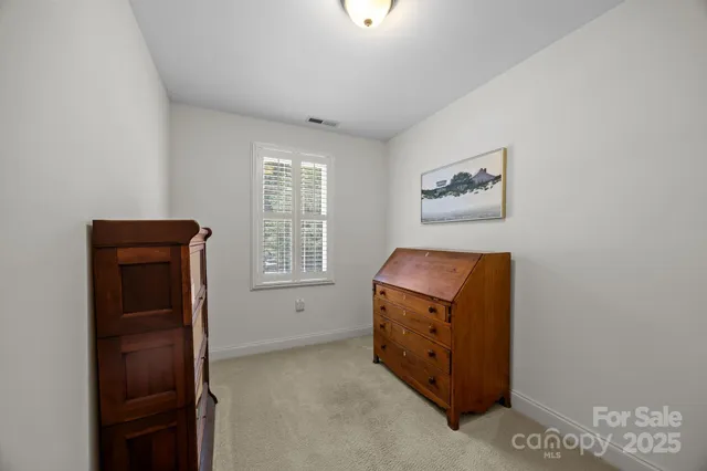 a view of room with window and cabinet