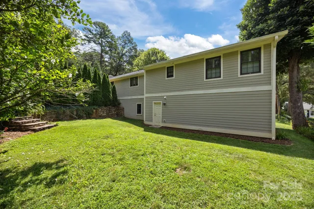 a view of a backyard of the house