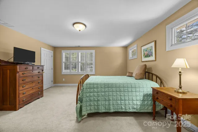 a bedroom with a bed and furniture