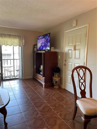 a view of a livingroom with furniture and a window