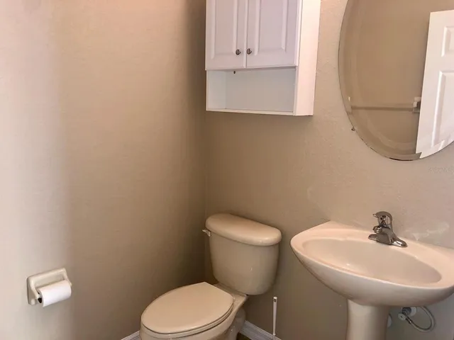 a view of a hallway with a white door