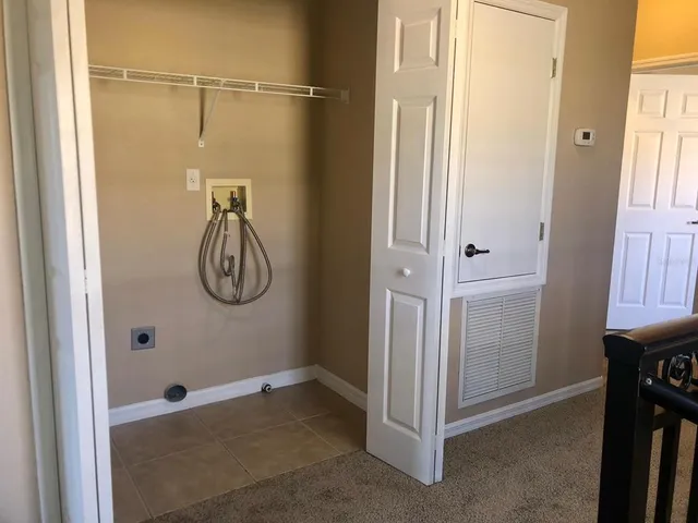 a view of entryway with wooden floor and stairs