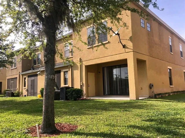 a kitchen with stainless steel appliances kitchen island granite countertop a refrigerator and a sink