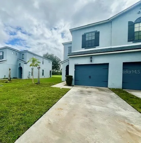 a kitchen with stainless steel appliances granite countertop a refrigerator a sink dishwasher and wooden cabinets with a granite countertops
